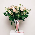 Timeless Blush bouquet with blush roses and lisianthus in glass vase