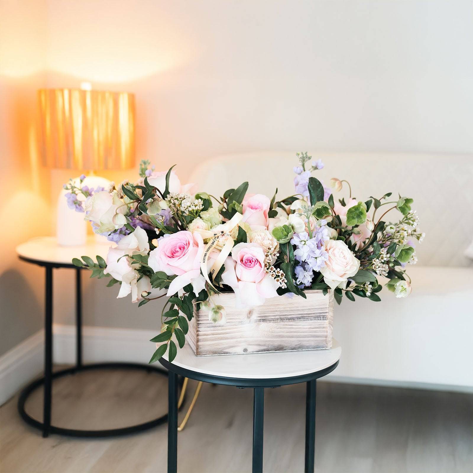 Lavender Bliss bouquet as decor on round table with warm light