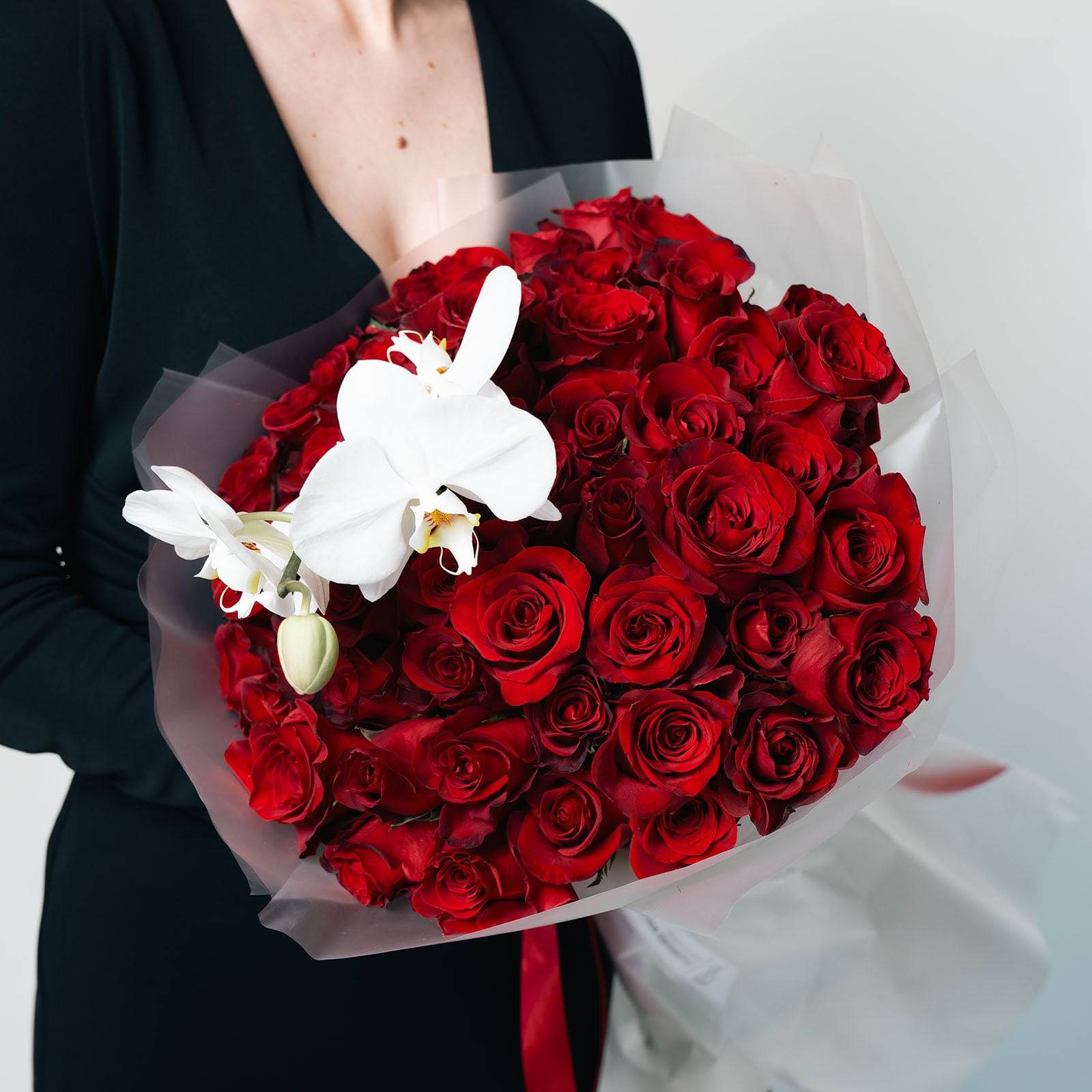Orchid Embrace bouquet with red roses and white orchid wrapped in white paper