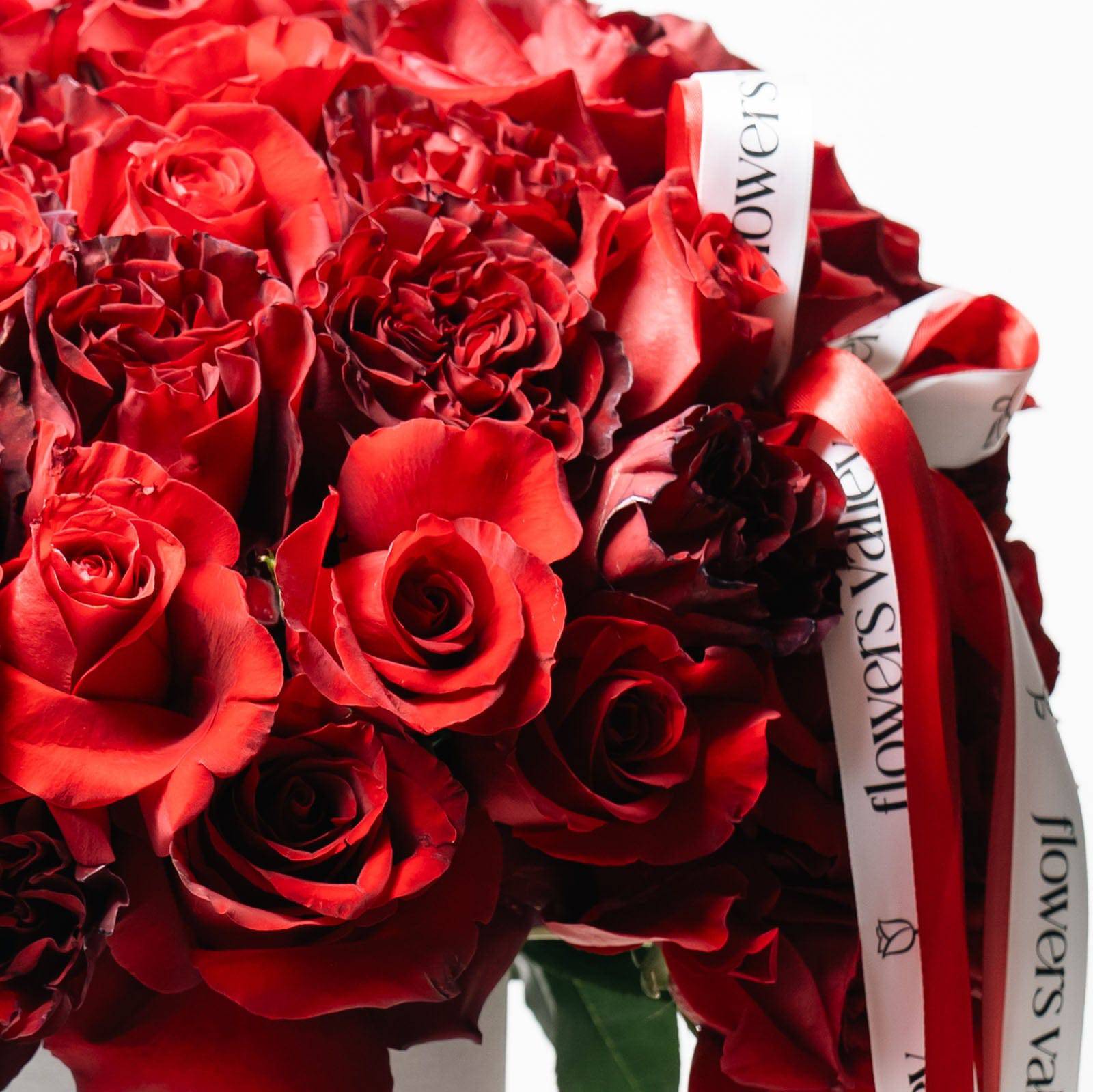 Close-up of layered red garden roses in luxury bouquet