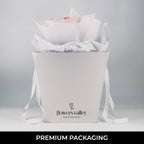 Flowers Valley’s signature white gift bag with tulip bouquet inside—ready for next-day delivery or local pickup.