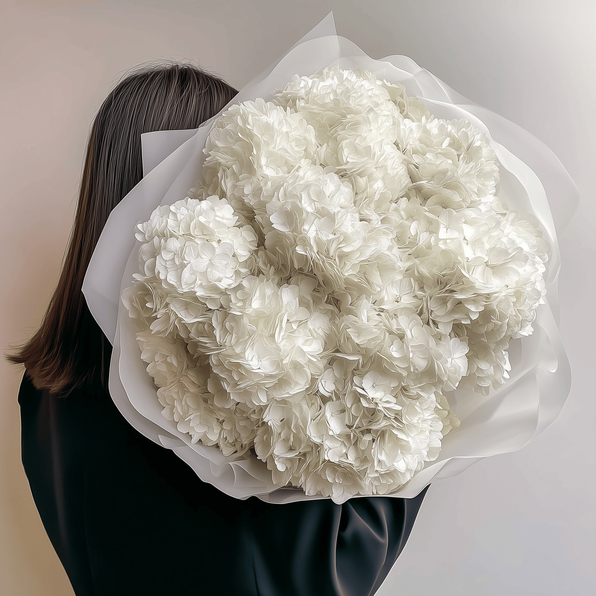 Round ivory hydrangea bouquet held behind the back—soft and clean floral statement.
