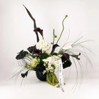 Luxury floral arrangement with black calla lilies, white hydrangeas, and anthuriums – Modern Noir Elegance by Flowers Valley